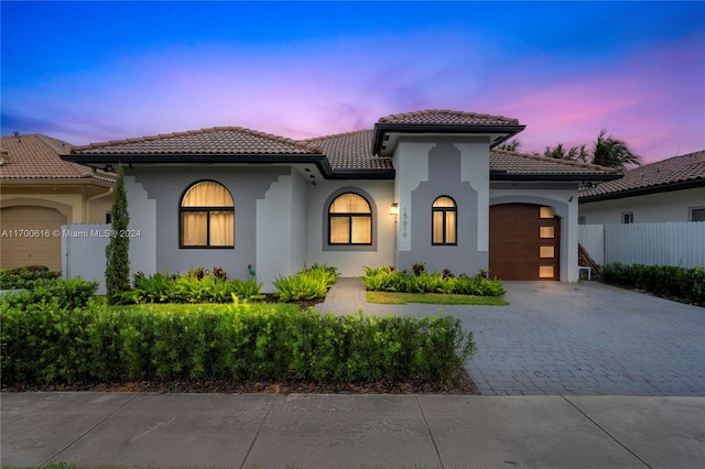 mediterranean / spanish-style home featuring a garage