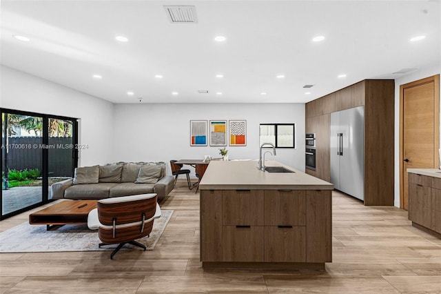 interior space with light hardwood / wood-style floors and sink