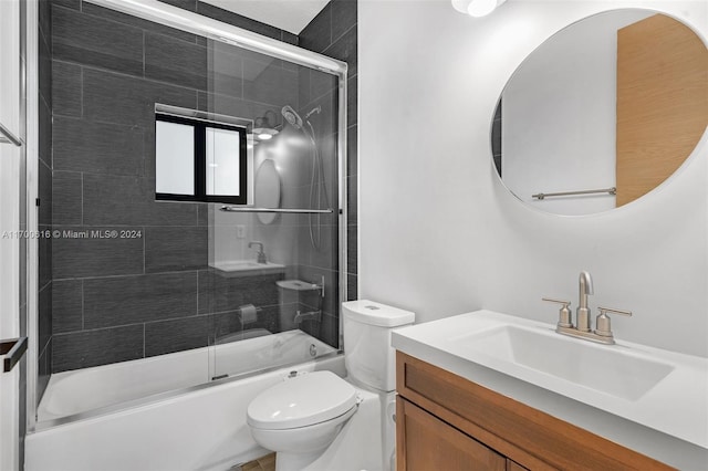 full bathroom with vanity, toilet, and enclosed tub / shower combo