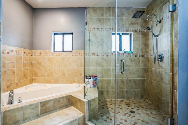 bathroom with shower with separate bathtub