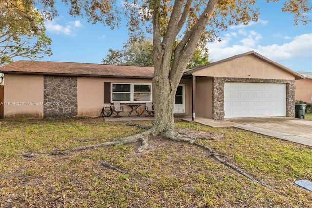 ranch-style home featuring a garage