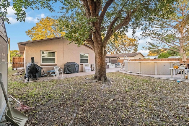 rear view of property featuring a patio