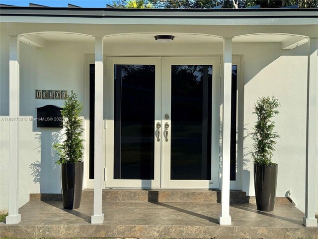 property entrance featuring french doors