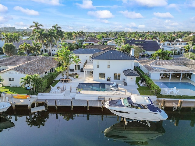 bird's eye view featuring a water view and a residential view