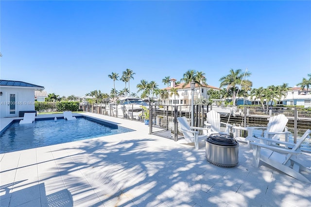 view of swimming pool featuring a patio area