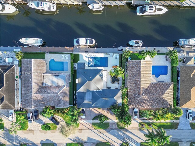 birds eye view of property featuring a water view