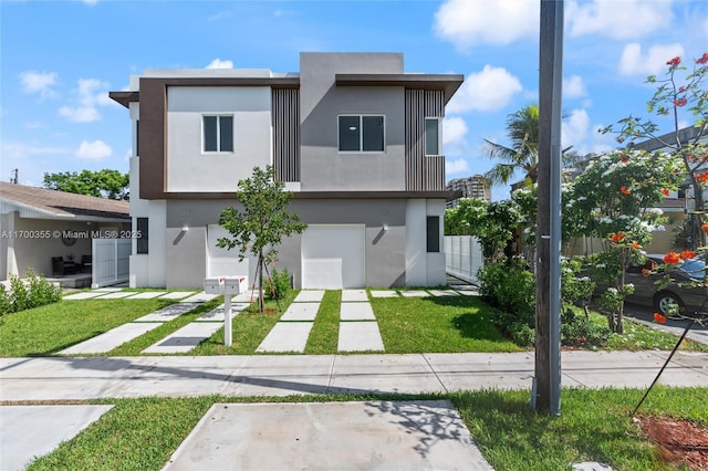 modern home with a garage and a front lawn