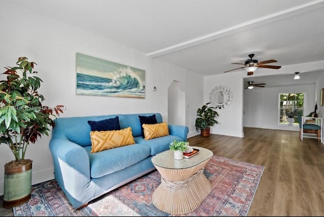 living room featuring hardwood / wood-style flooring and ceiling fan