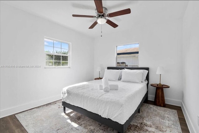 bedroom featuring ceiling fan and dark hardwood / wood-style flooring