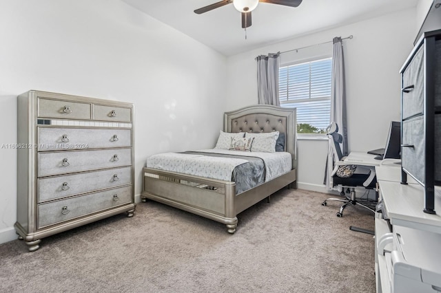 bedroom with light carpet and ceiling fan