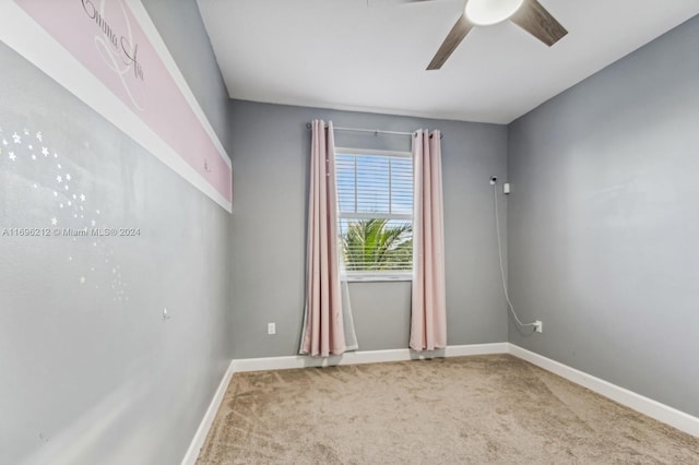 empty room with carpet and ceiling fan