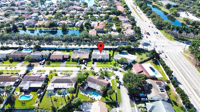 birds eye view of property with a water view