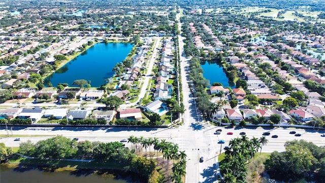 drone / aerial view with a water view