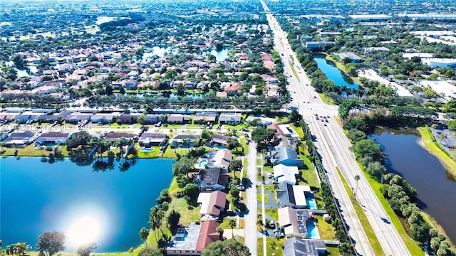 bird's eye view with a water view