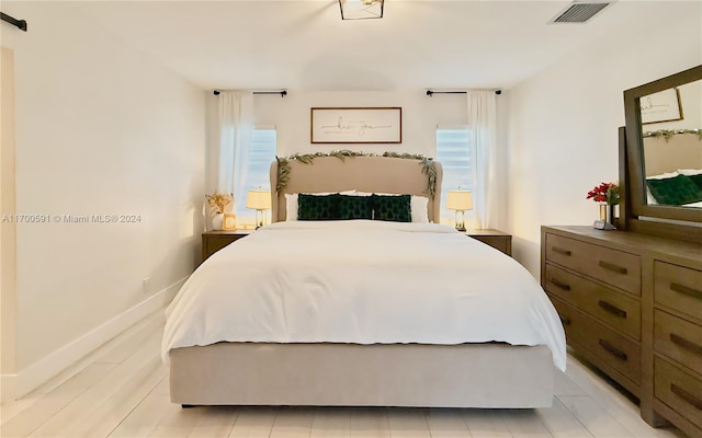 bedroom with light hardwood / wood-style floors