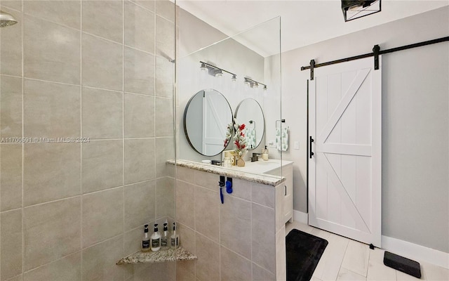 bathroom featuring sink and tiled shower