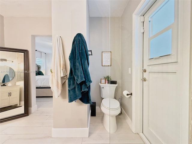 bathroom featuring vanity and toilet