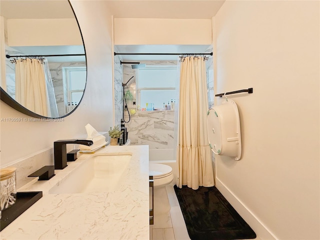 full bathroom featuring tile patterned flooring, vanity, toilet, and shower / bathtub combination with curtain