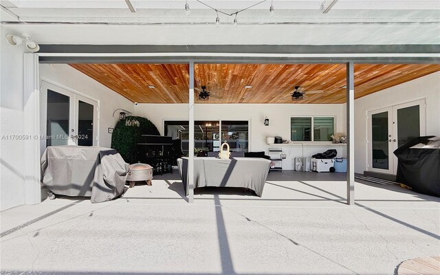 view of patio / terrace with french doors and ceiling fan