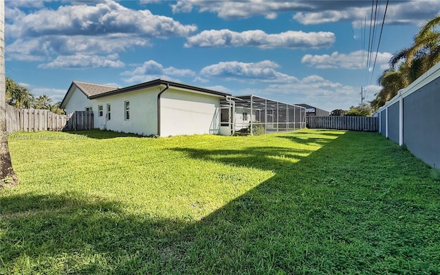 view of yard with a lanai