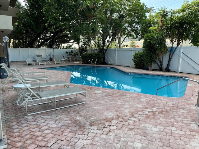 view of pool featuring a patio