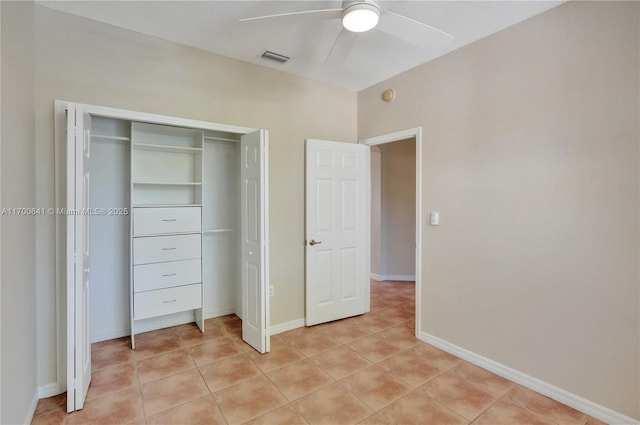 12564 SW 121st Way, Miami, FL 33186 - unfurnished bedroom featuring light tile patterned flooring, a closet, ceiling fan, and baseboards