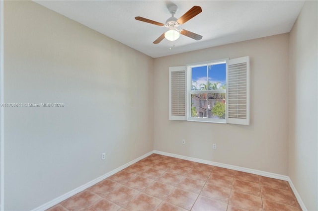 tiled spare room with ceiling fan