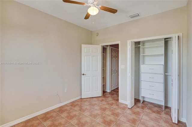 unfurnished bedroom featuring light tile patterned floors and ceiling fan