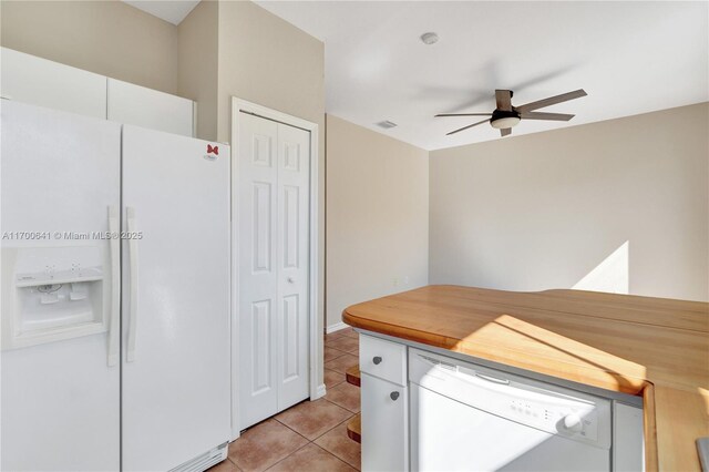 kitchen featuring white cabinetry, white appliances, ceiling fan, and light tile patterned flooring