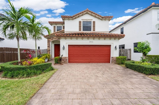 mediterranean / spanish-style home featuring a garage