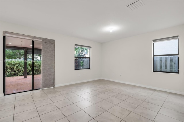 empty room with light tile patterned floors