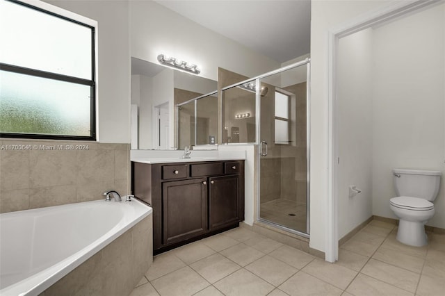 full bathroom featuring tile patterned flooring, vanity, toilet, and plus walk in shower