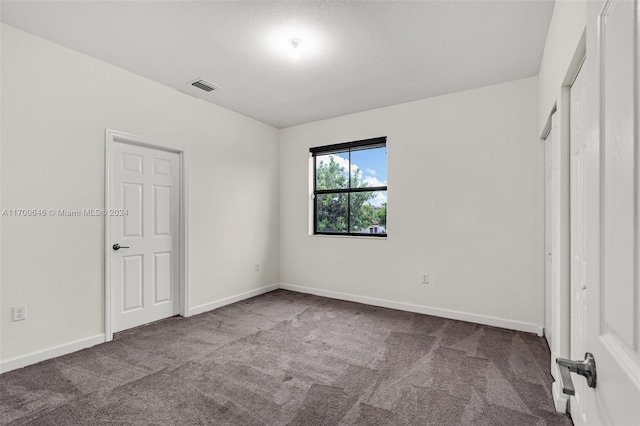 unfurnished bedroom featuring carpet