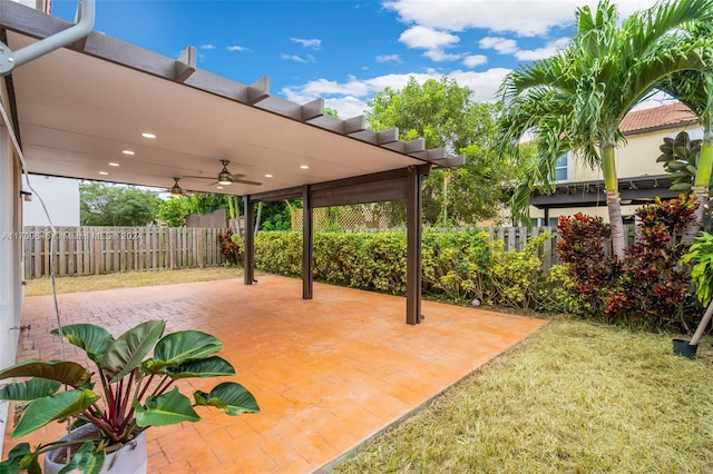 view of patio featuring ceiling fan