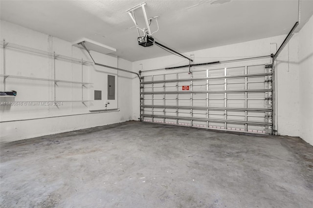 garage with electric panel and a garage door opener