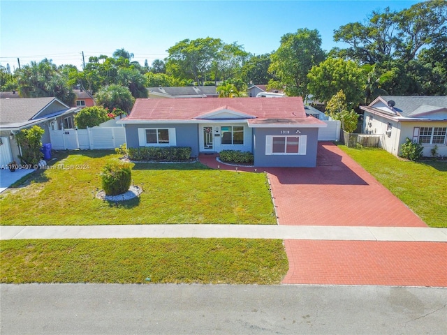 ranch-style house featuring a front lawn