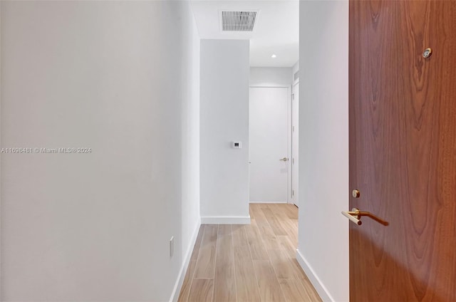 corridor featuring light hardwood / wood-style floors