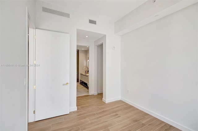 spare room featuring light hardwood / wood-style flooring