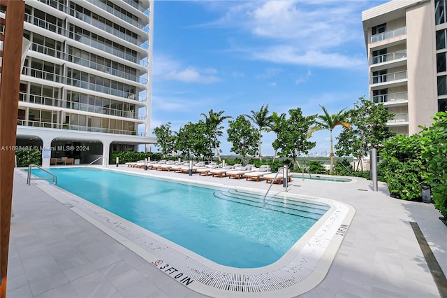 view of pool featuring a hot tub