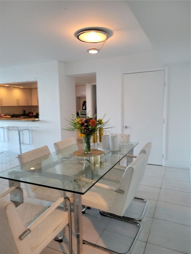 dining room with light tile patterned flooring