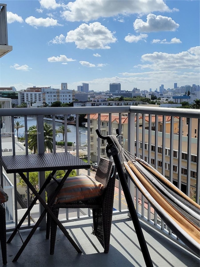 balcony featuring a water view