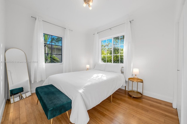 bedroom with light hardwood / wood-style flooring