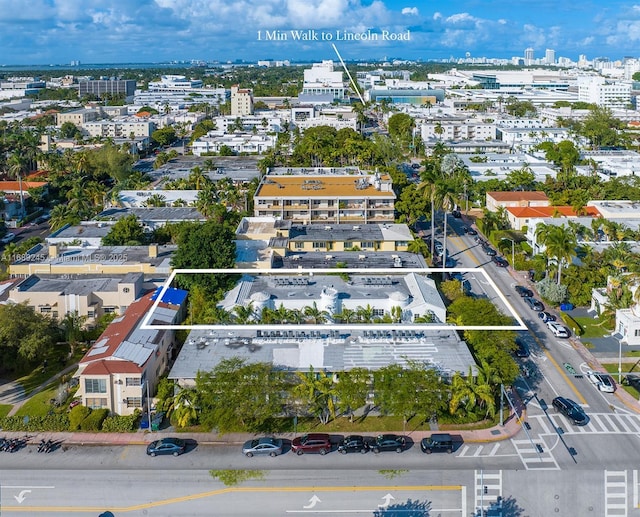 birds eye view of property with a view of city