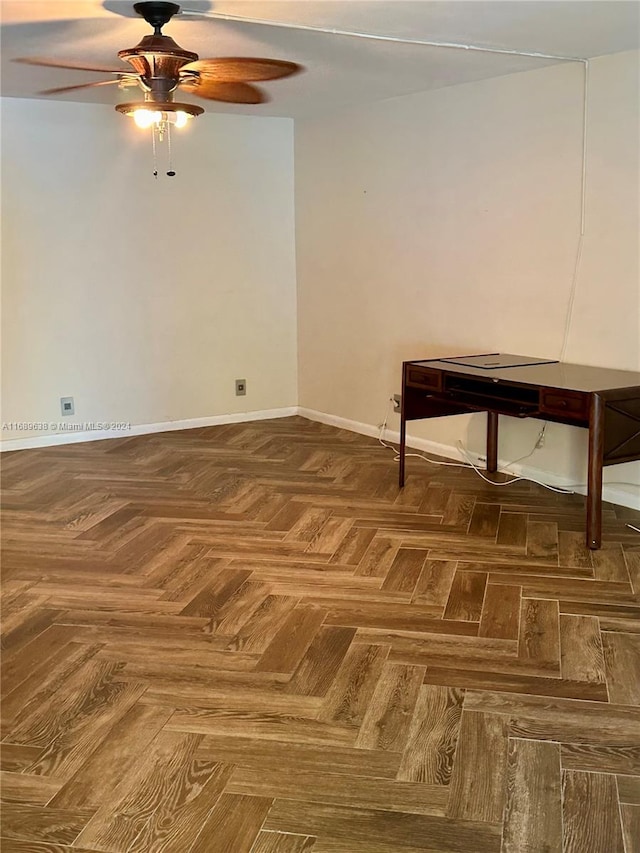 interior space with ceiling fan and parquet flooring