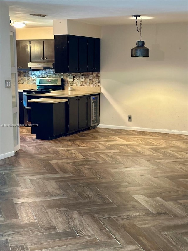 kitchen featuring wine cooler, decorative backsplash, dark parquet floors, and stainless steel range with electric stovetop