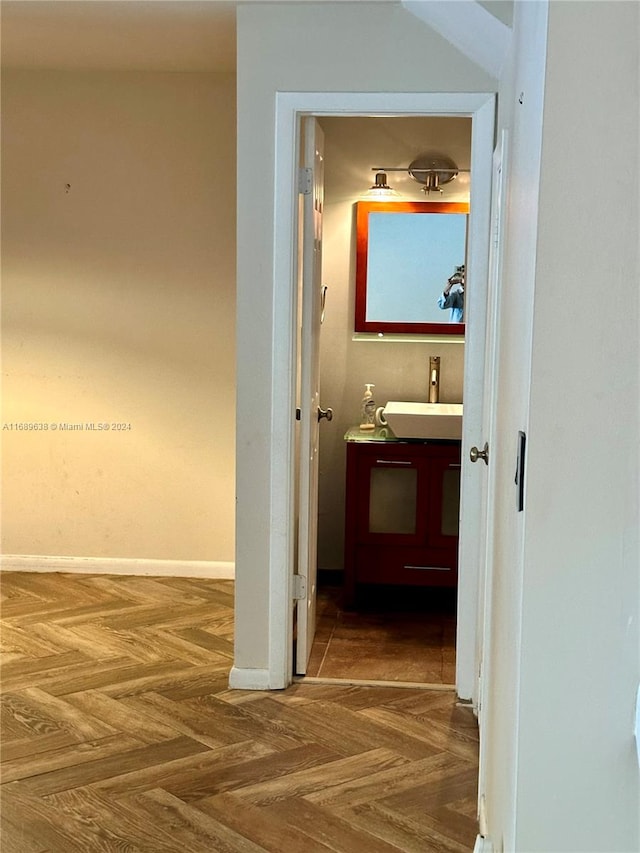 hall with sink and parquet floors