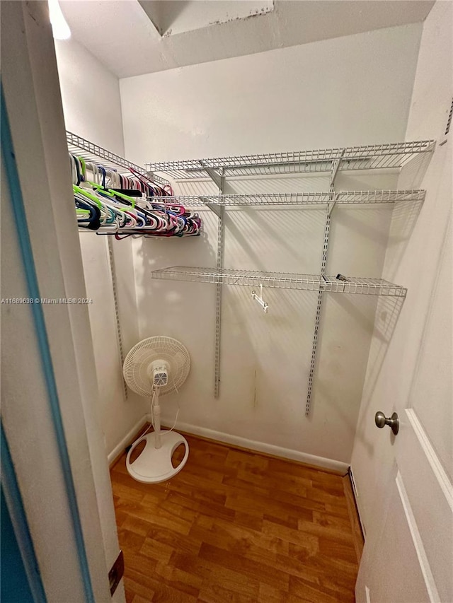 spacious closet featuring hardwood / wood-style floors