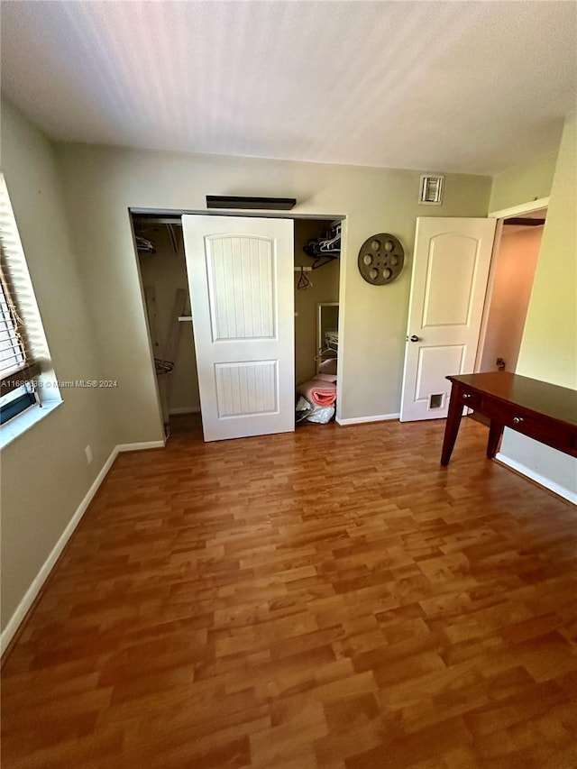 interior space featuring a closet and wood-type flooring