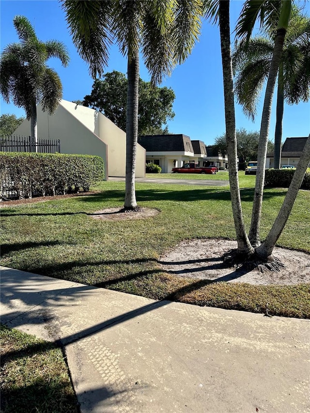 surrounding community featuring a yard