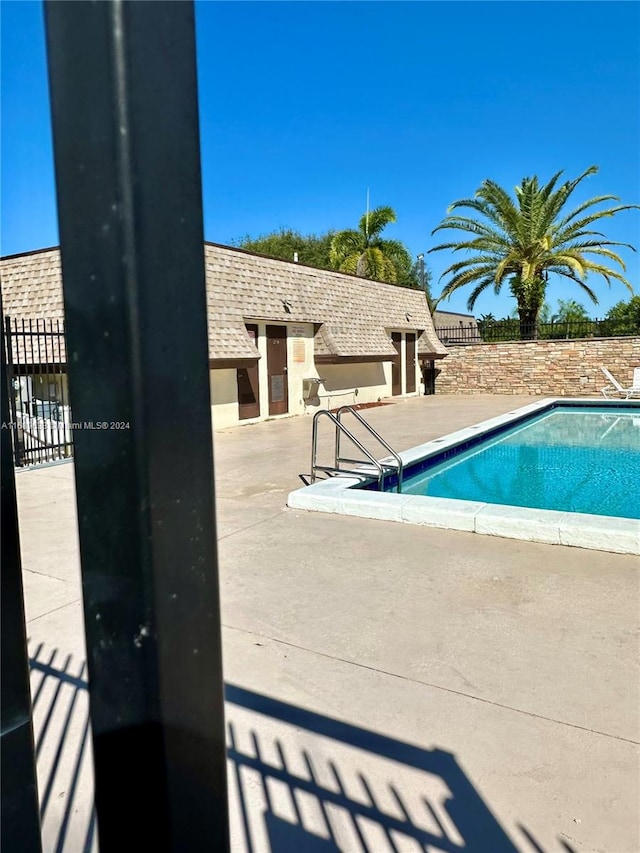 view of pool featuring a patio area